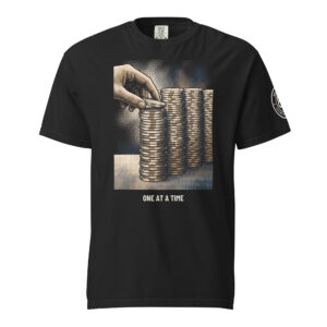 One at a Time tee in black, a halftone drawing of a hand setting one chip on a stack.