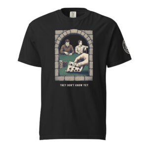 They Don't Know Yet tee in black: two players at a green table drawn inside a stone arch, a hand lifting eight-nine of spades.